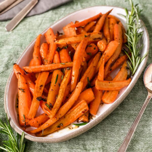 Honey glazed carrots with rosemary on table