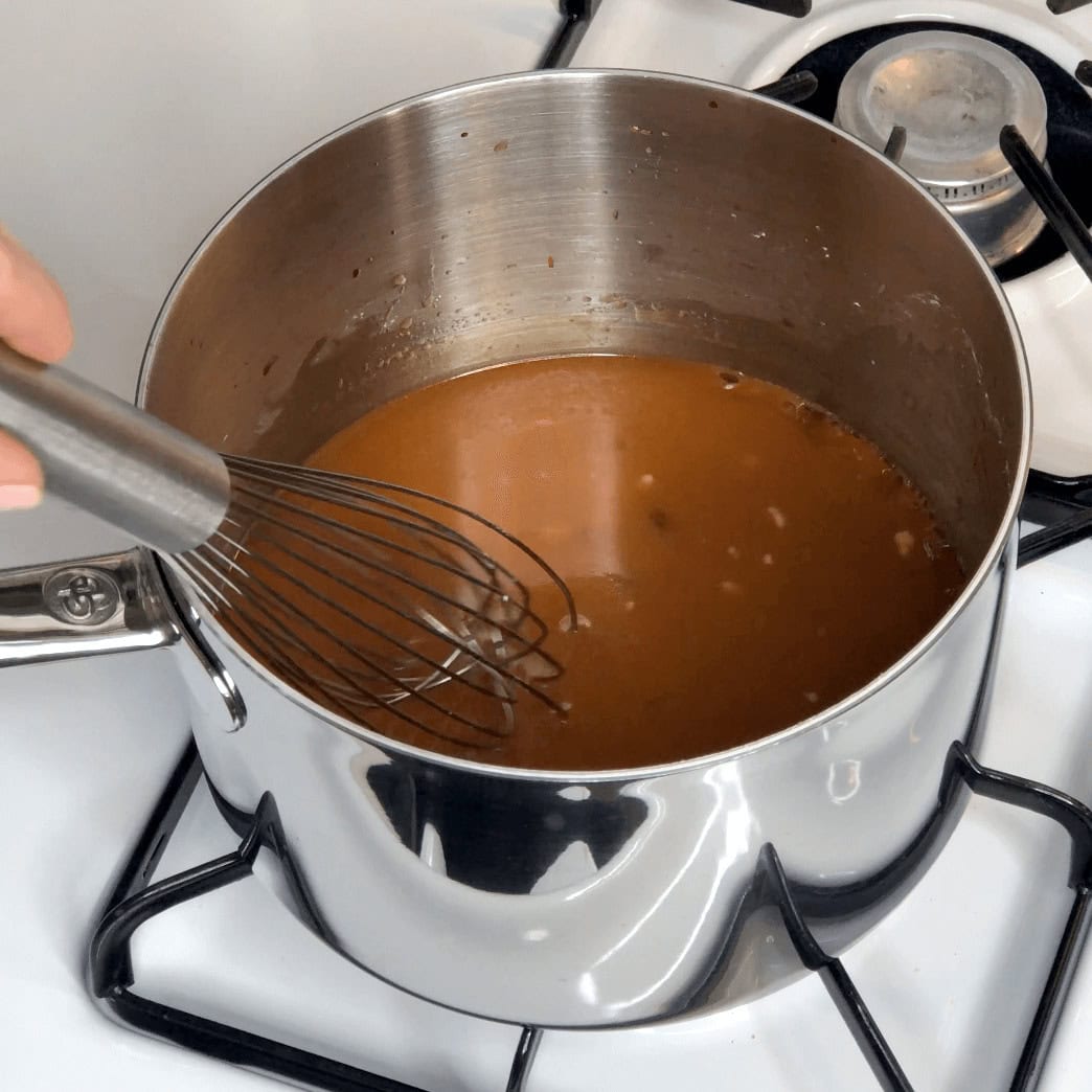 Ingredients for sweet and sour sauce in a saucepan.