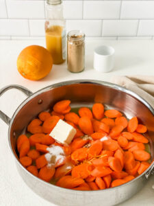 orange glazed carrots ingredients in pan