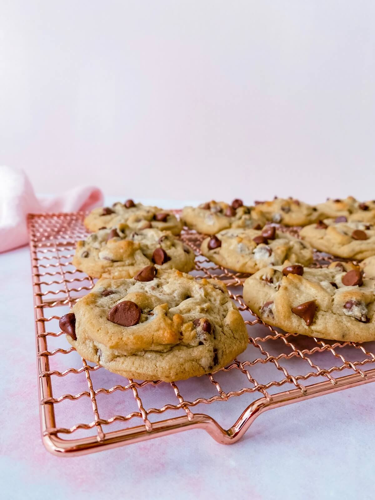 One dozen cookies cooling on a wire rack