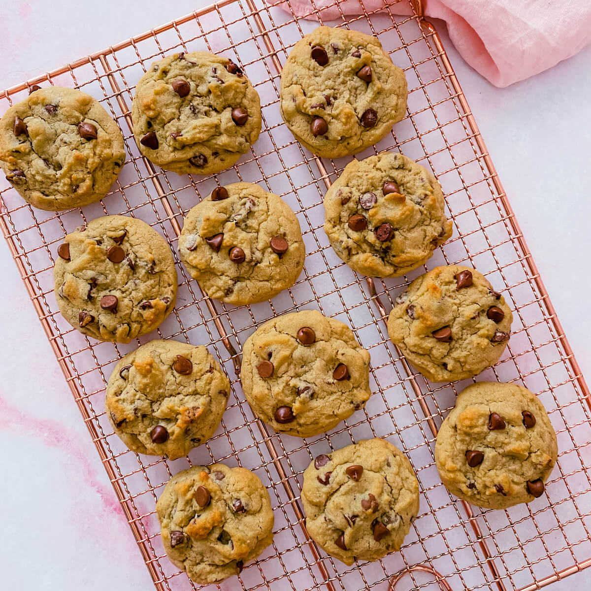 small batch of twelve cookies cooling on rack