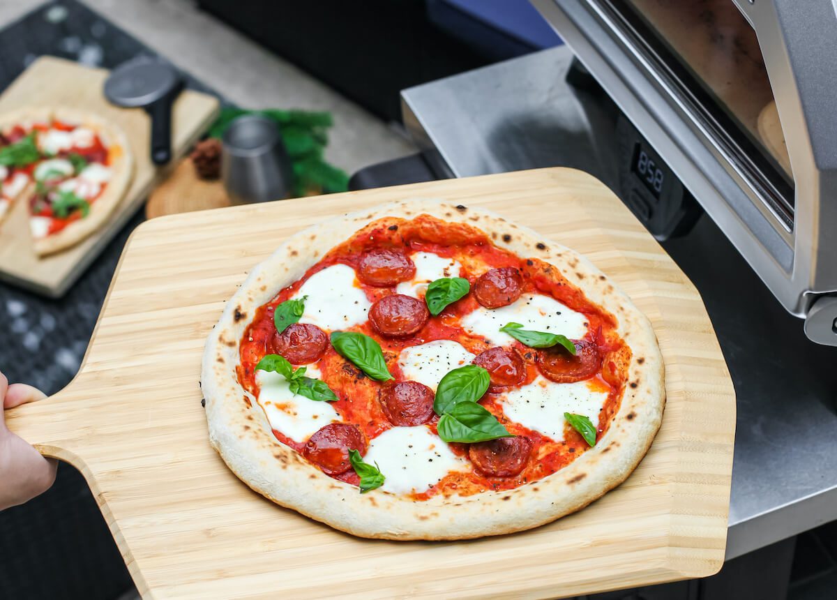 pizza on peel with basil