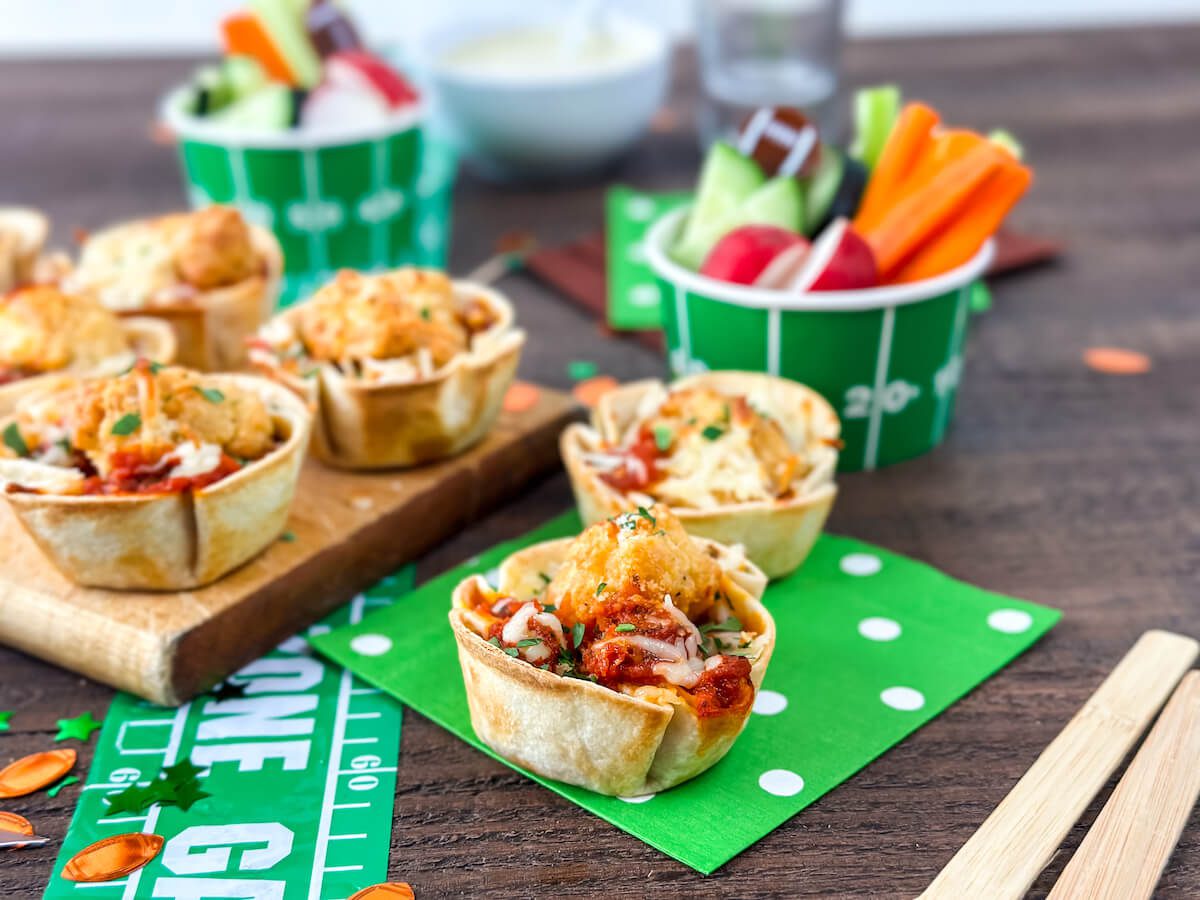 game day chicken parmesan cups on green napkin