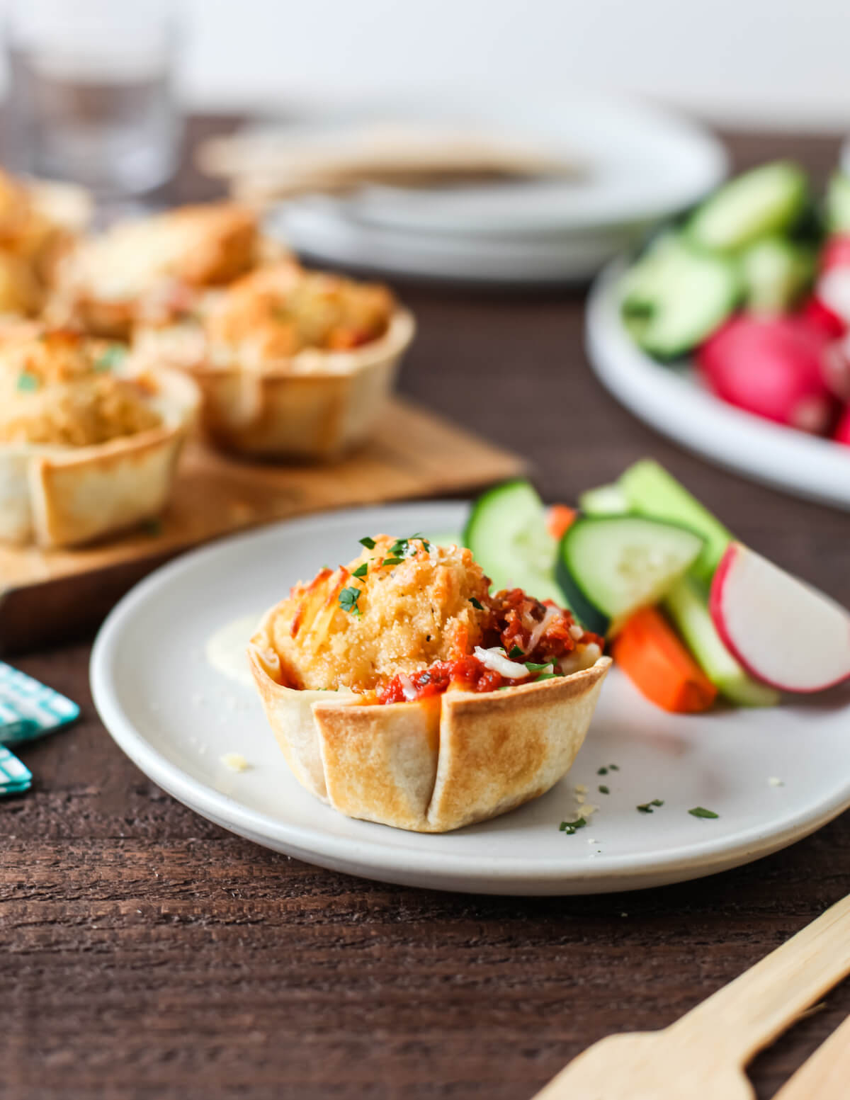 chicken Parmesan cups with veggies on a plate