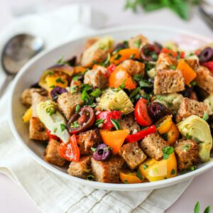 close up of panzanella with tomatoes and artichokes