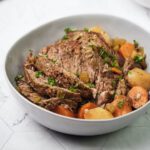 Finished classic pot roast sliced in a bowl