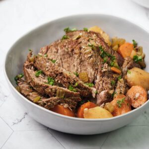 Finished classic pot roast sliced in a bowl