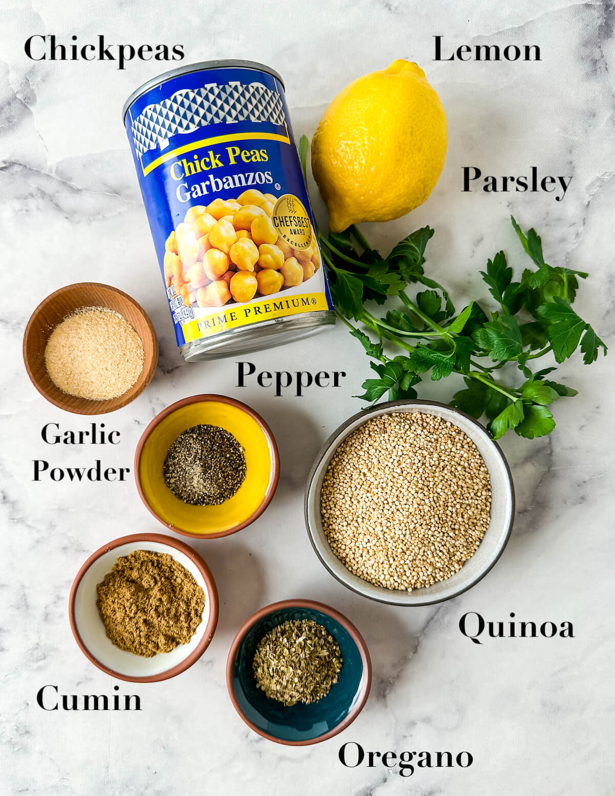 Ingredients on marble for lemon chickpeas and quinoa