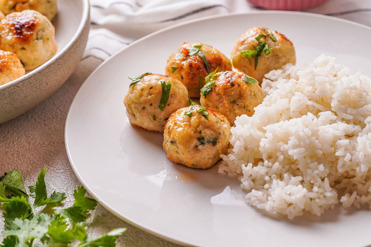 close up of Thai chicken meatballs and white rice.