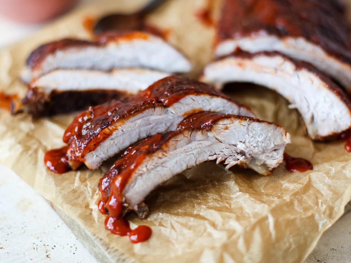 close up of cut ribs with sauce