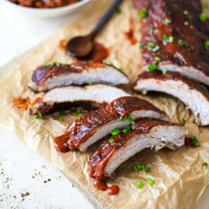 cut ribs with sauce on parchment paper