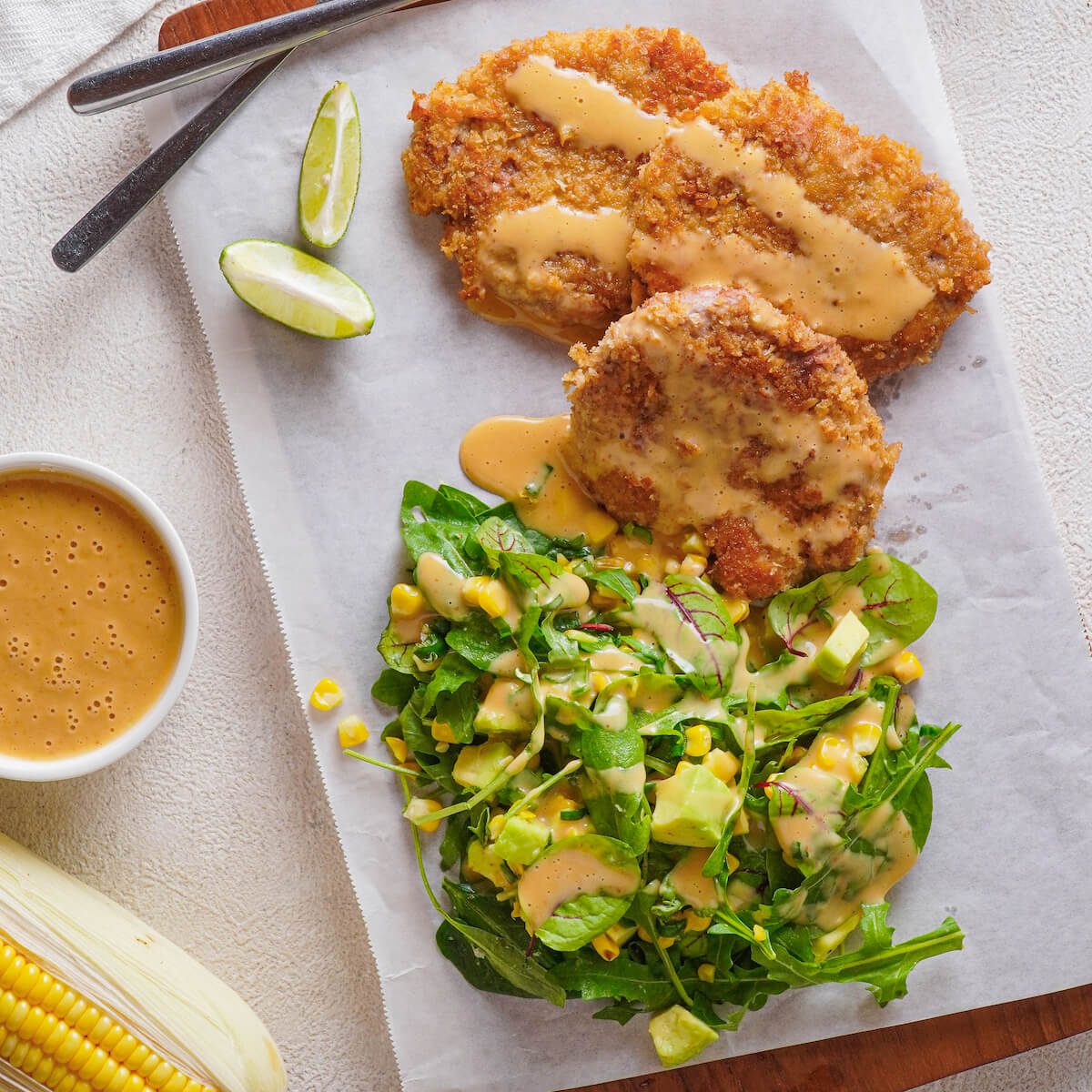 breaded pork cutlets and southwestern salad with spicy dressing