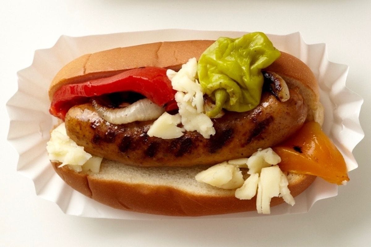 Chicken sausage with toppings.