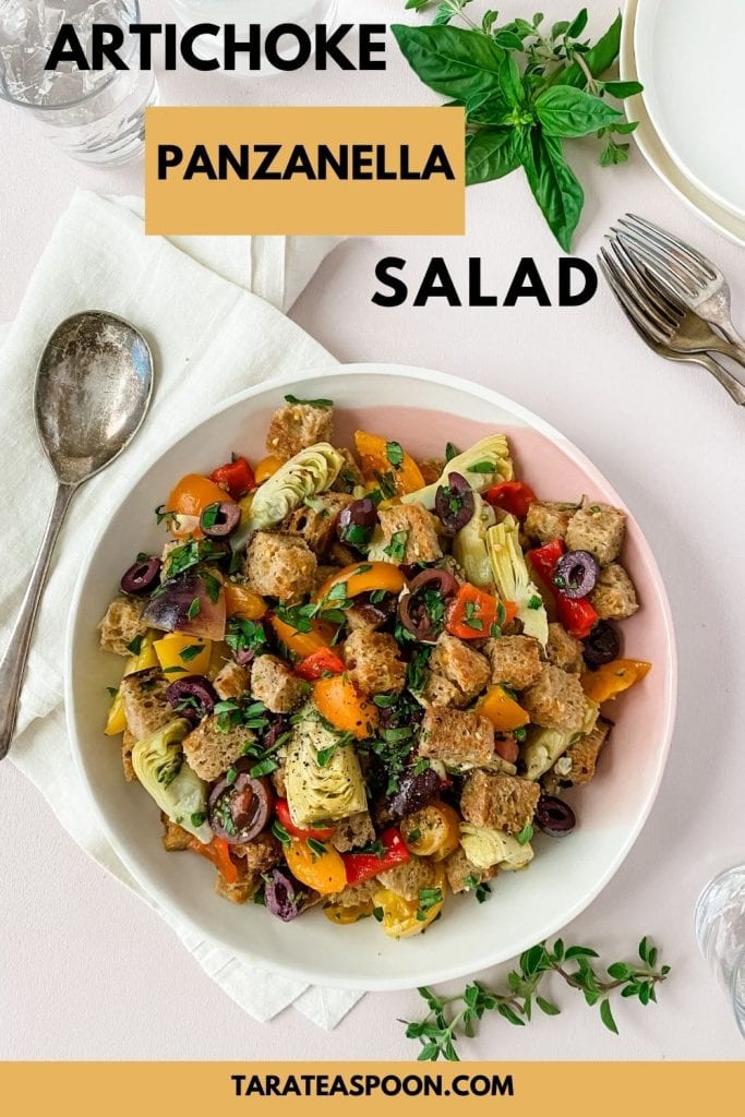 Tomato and artichoke panzanella pin image of salad in bowl