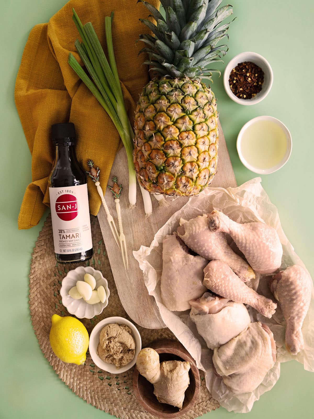 Top view of ingredients needed to make grilled chicken and pineapple. 