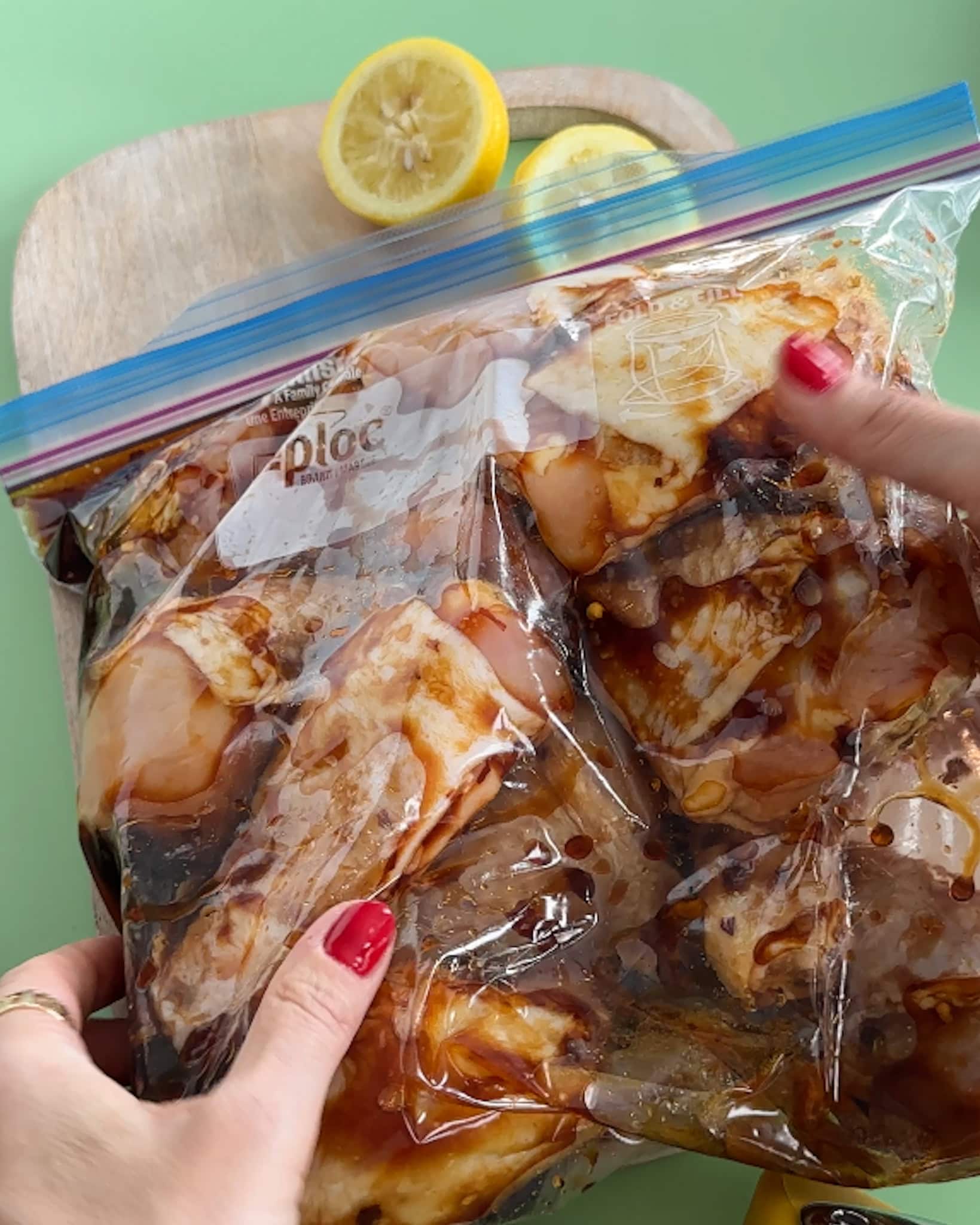 Raw chicken in a zipper bag marinating. 