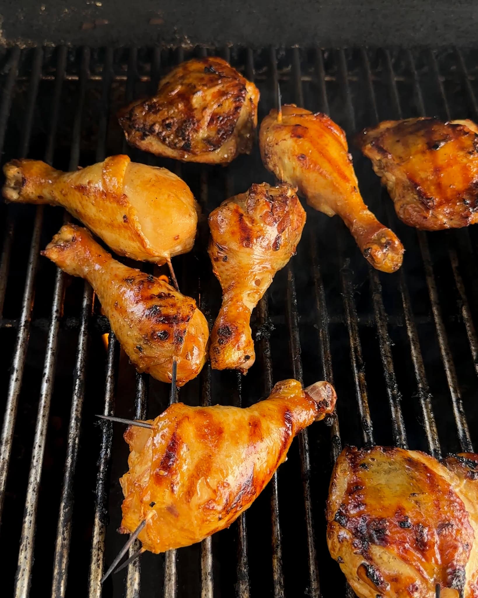 Grilled chicken on a grill. 