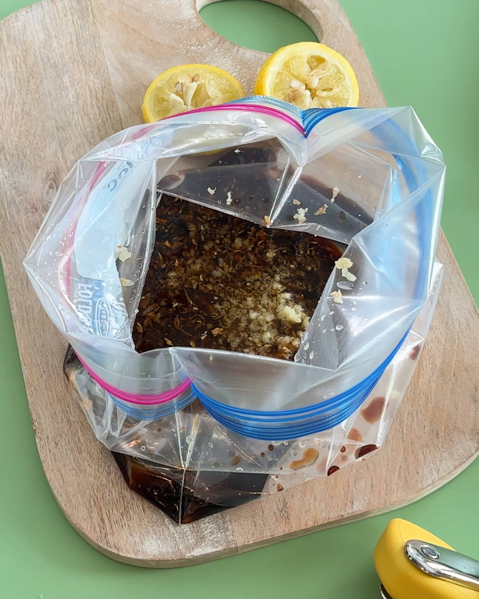 A plastic zipper filled with chicken marinade. 