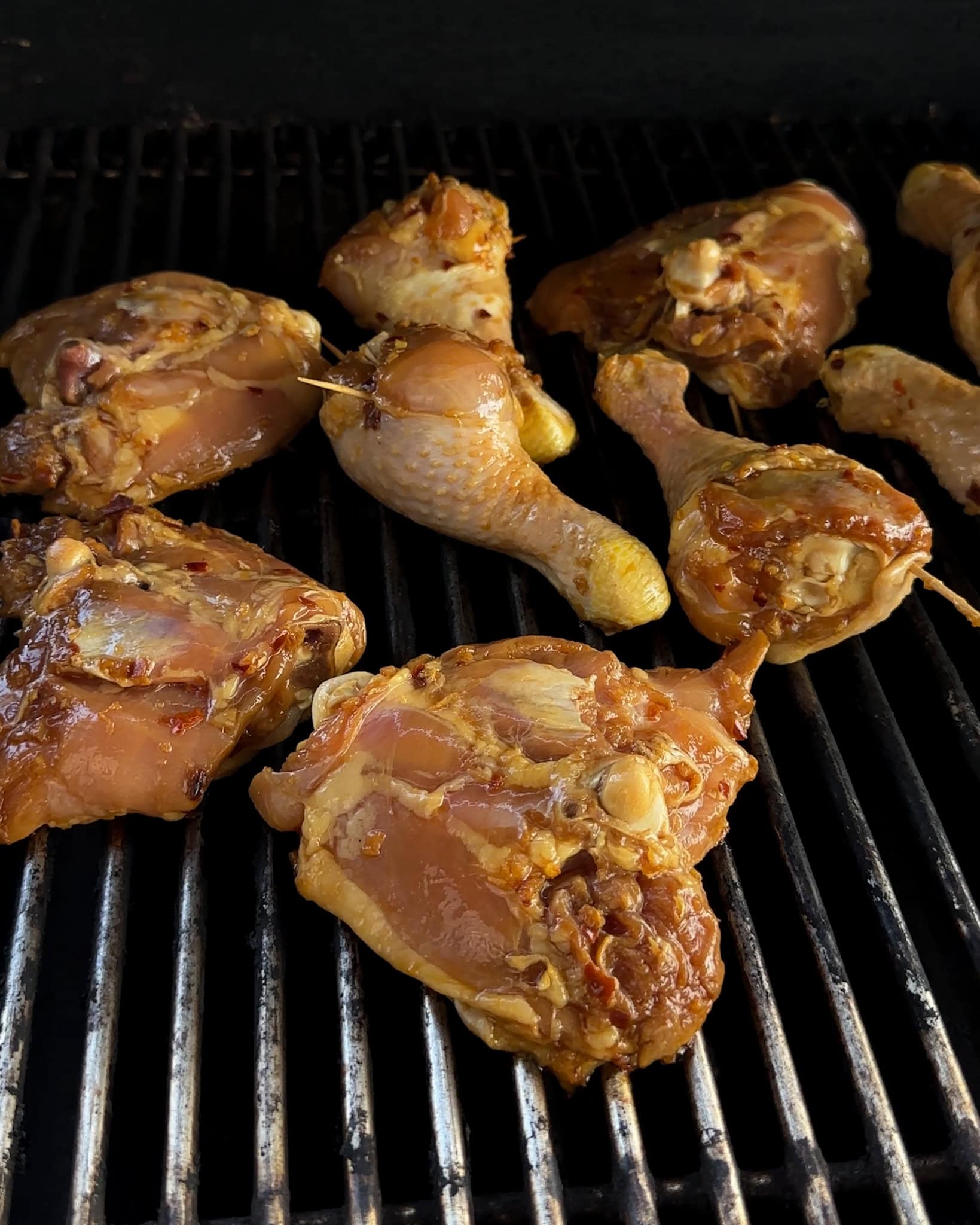Marinated chicken on a hot grill.