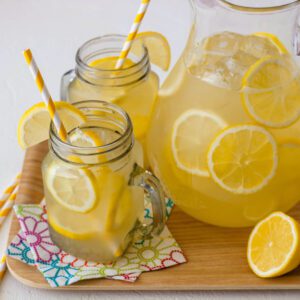 looking into mugs on lemonade with lemon slices and ice