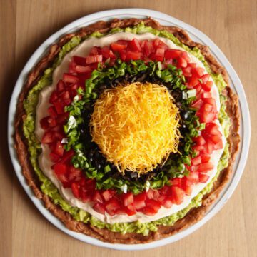 Bullseye style, round design 7 layer dip where you can see all the layers of ingredients in a circular pattern.