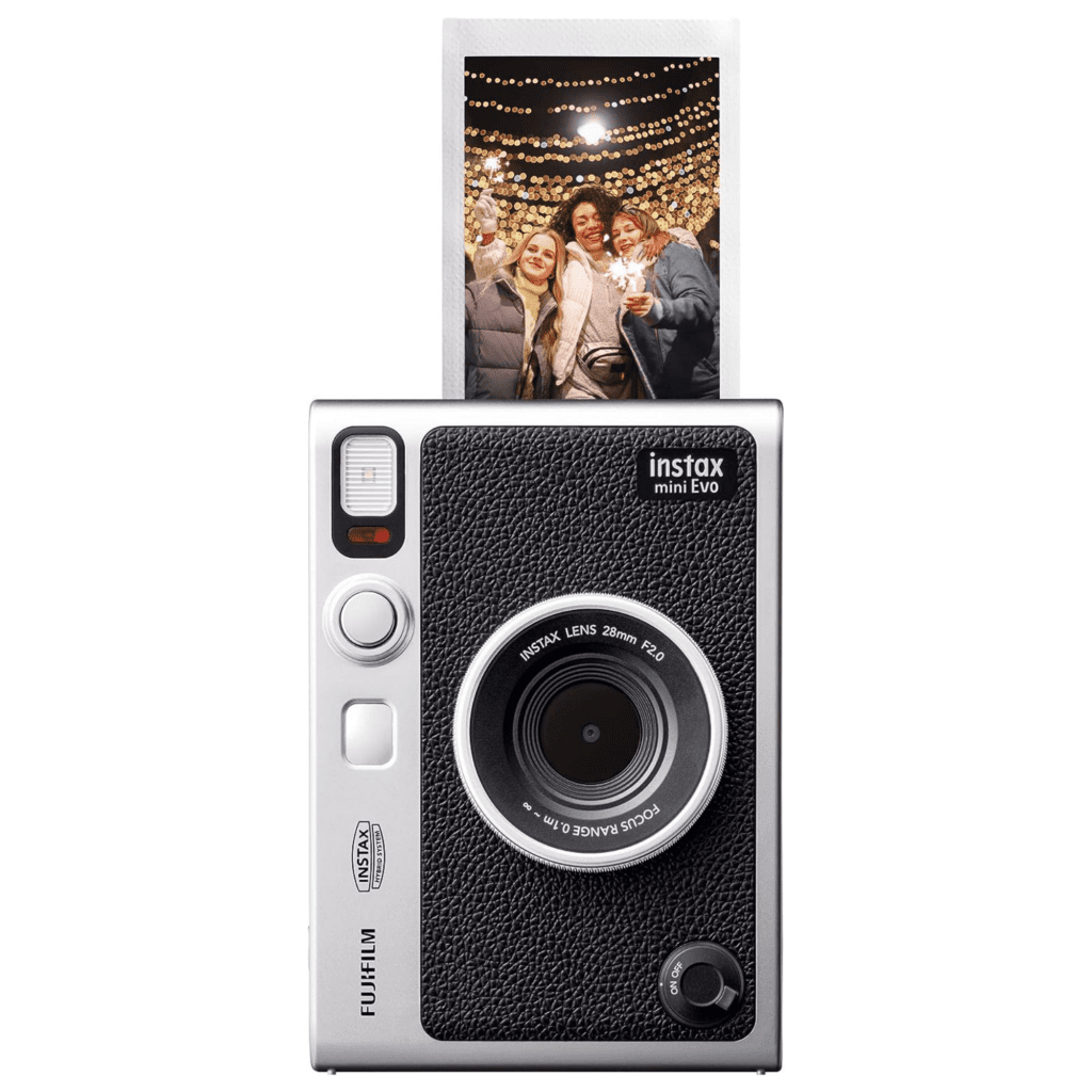 A black and silver Fuji film INSTAX camera with a freshly taken picture popping out of the top.