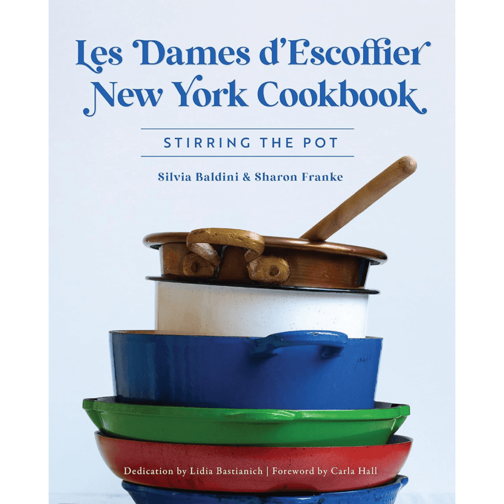 The cover of Stirring the Pot by Les Dames d'Escoffier New York, showing a stack of colorful pots over a light blue background.