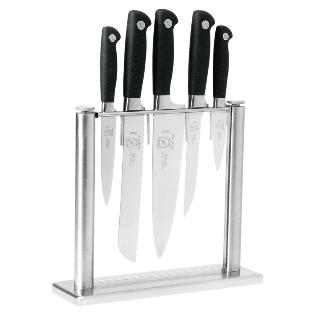 Mercer Culinary's 6-piece knife set in black placed inside a tempered glass block over a white background.