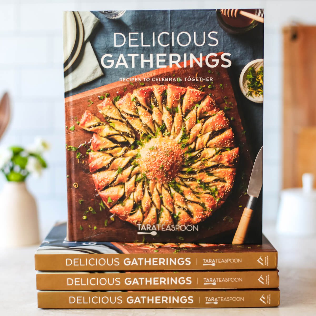 Stack of Delicious Gatherings books.
