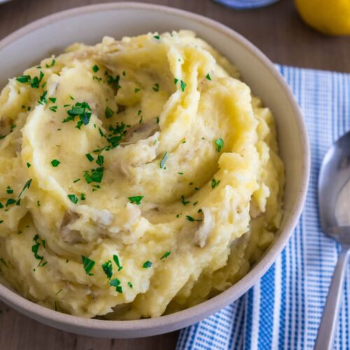 Close, feature image of yukon gold mashed potatoes in a bowl.