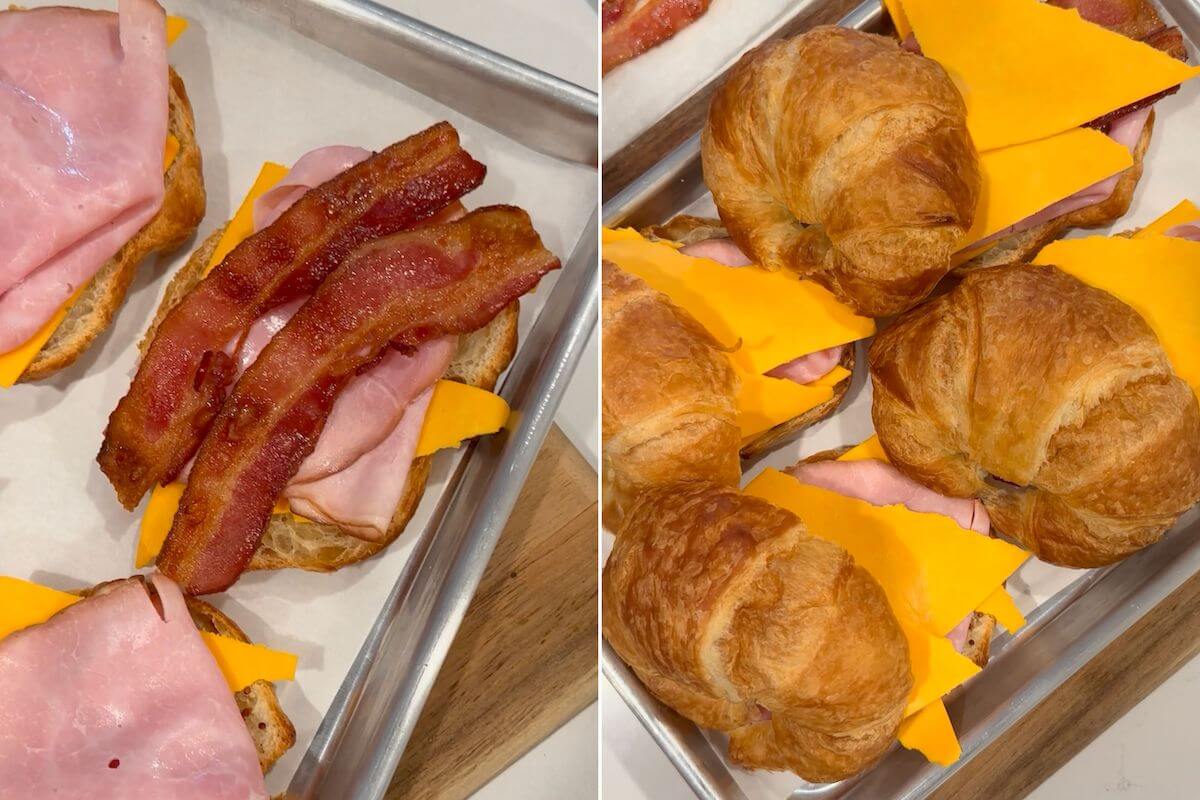 placing bacon on top of the croissant breakfast sandwich and then placing the croissant tops to the side of the sandwich