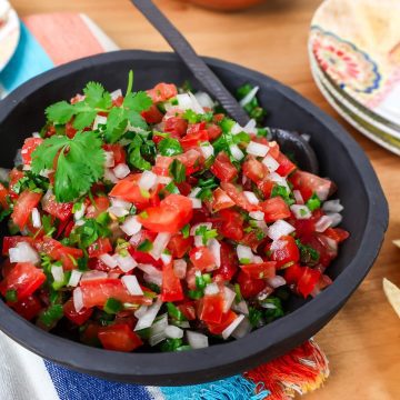 Bowl of pico de gallo salsa with tomatoes and jalapeno.