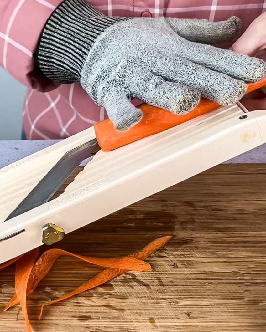 Holding fingers out of the way on a mandoline slicer.
