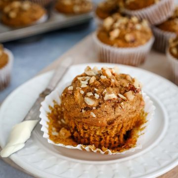 Feature close up of unwrapped pumpkin banana muffin.