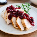 Cranberry sauce on sliced crockpot turkey breast.