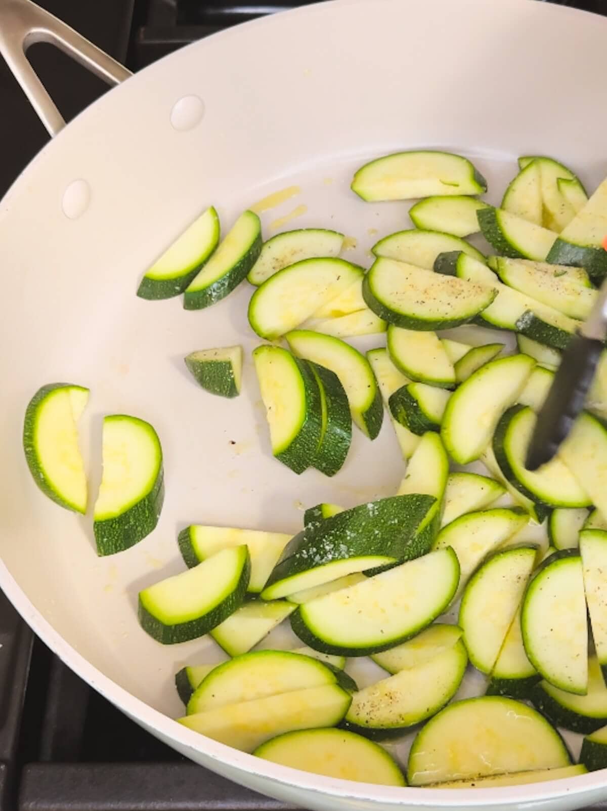 Cut zucchini in a frying pan.