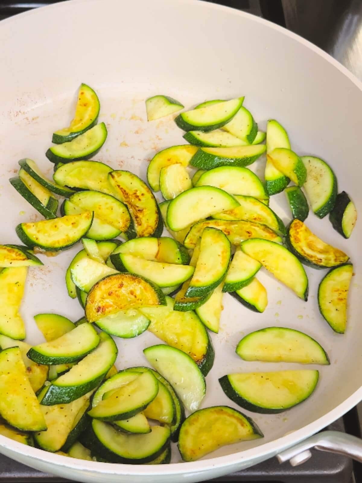 Gently fried zucchini in a frying pan.