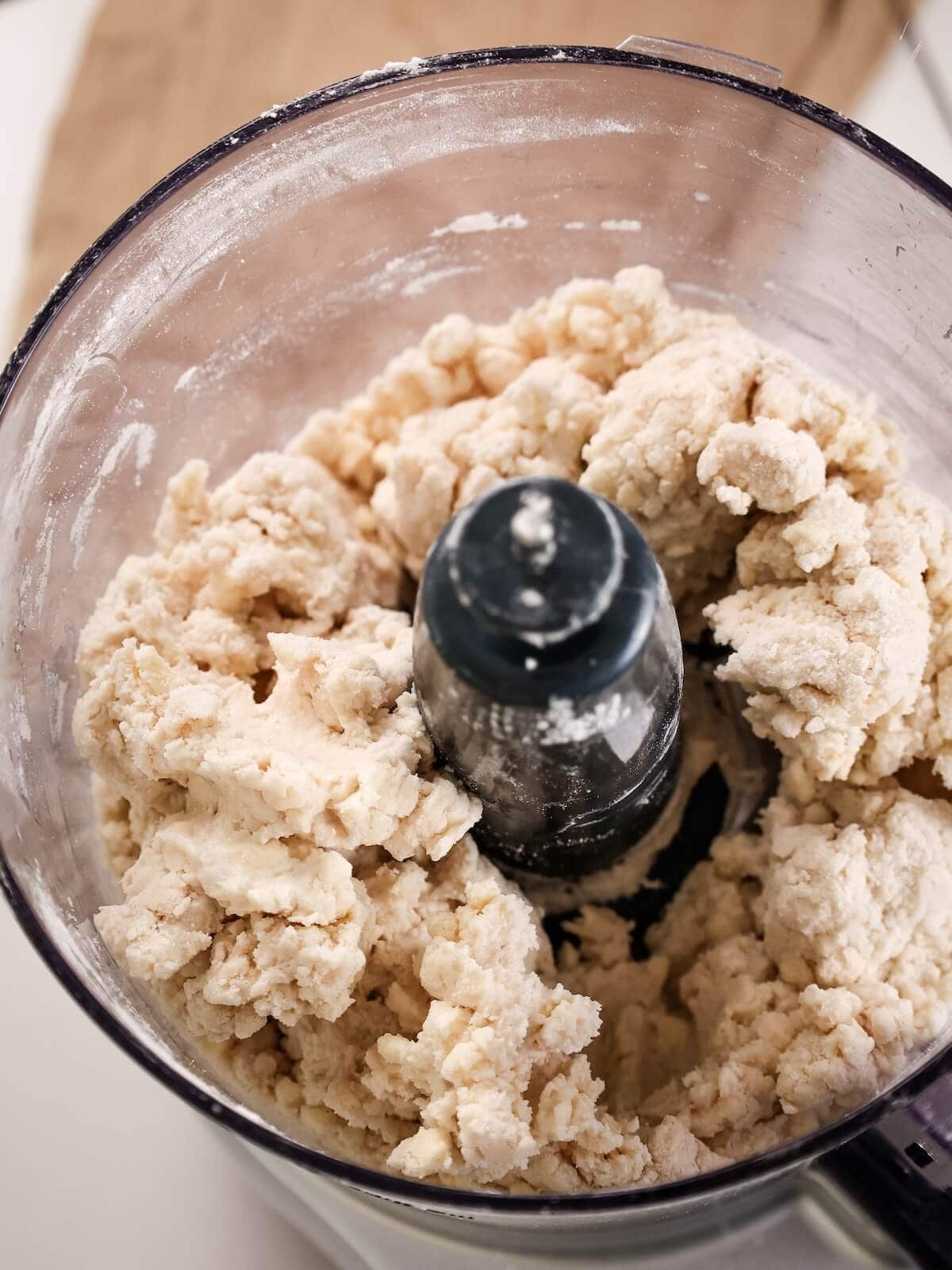 Crumbly pie crust in a food processor.
