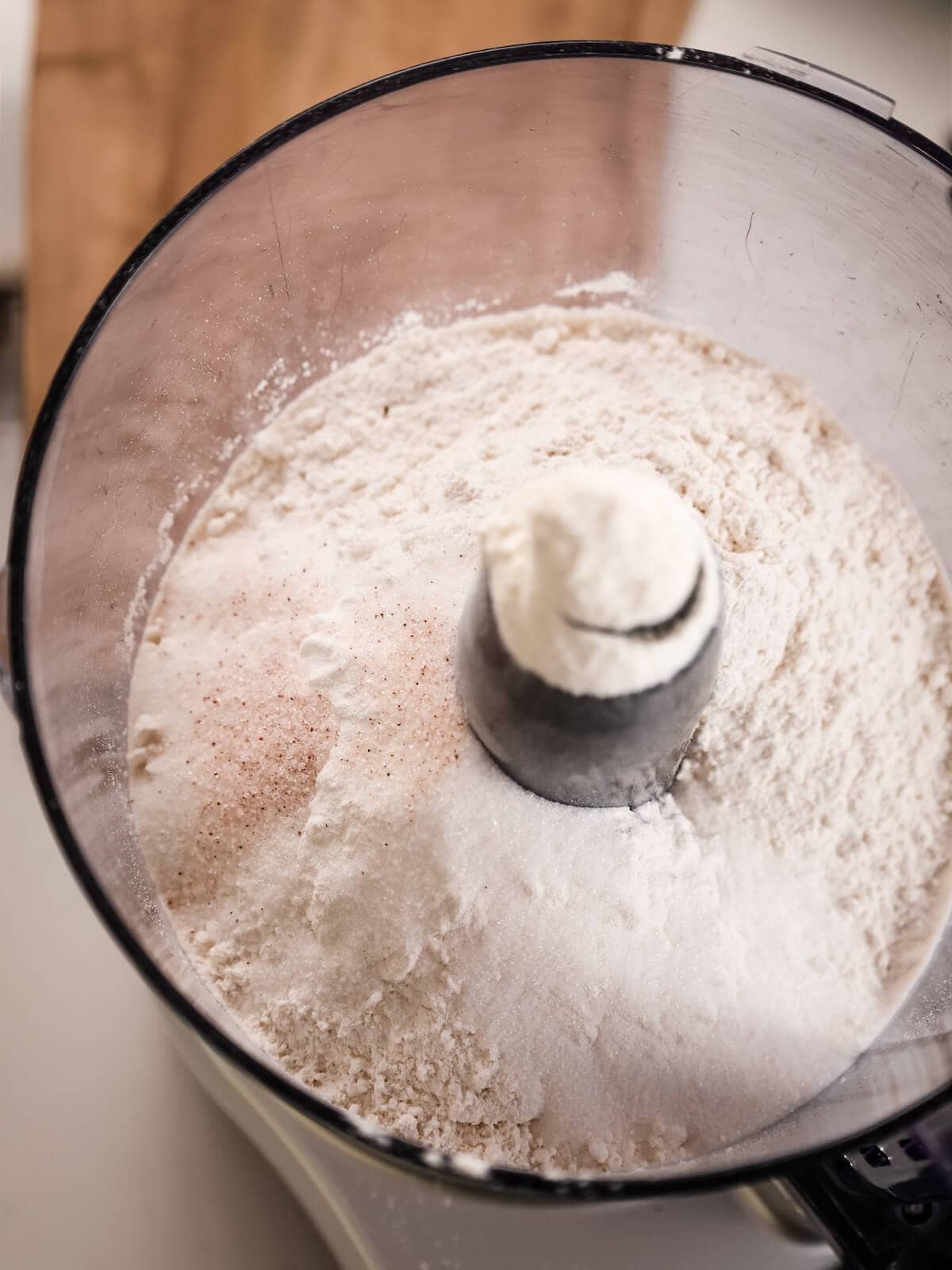 Dry ingredients for a pie crust in a food processor.