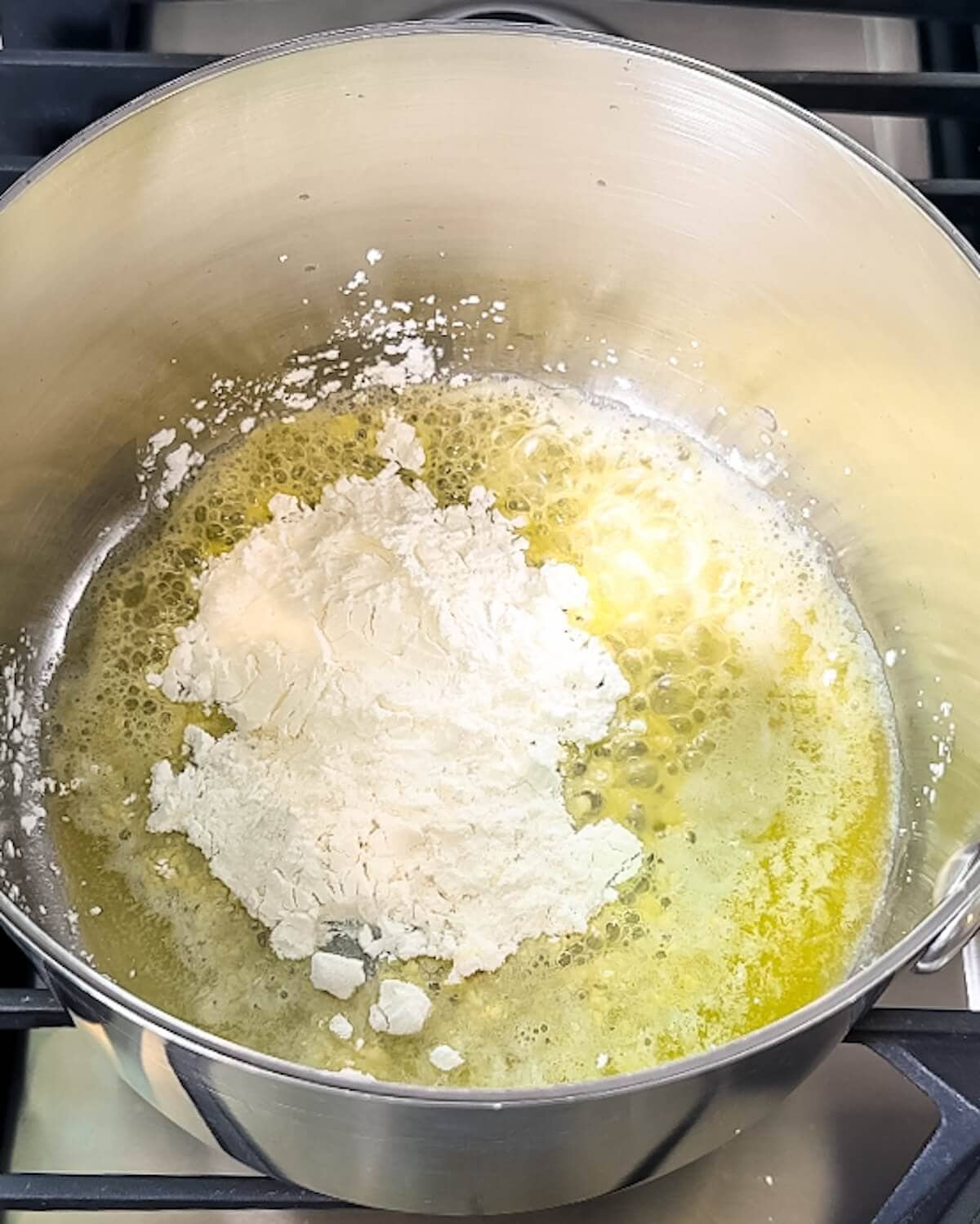 Butter melting in a saucepan with flour and cornstarch.