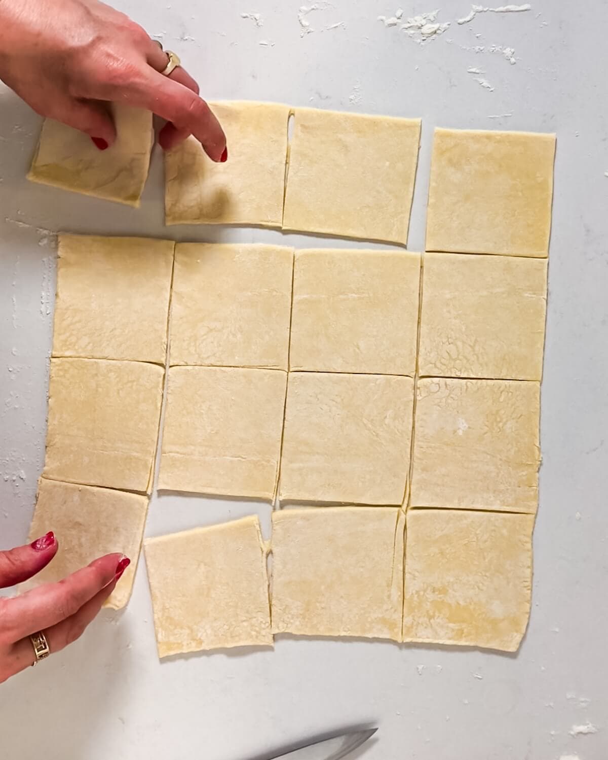 Sixteen squares of puff pastry.