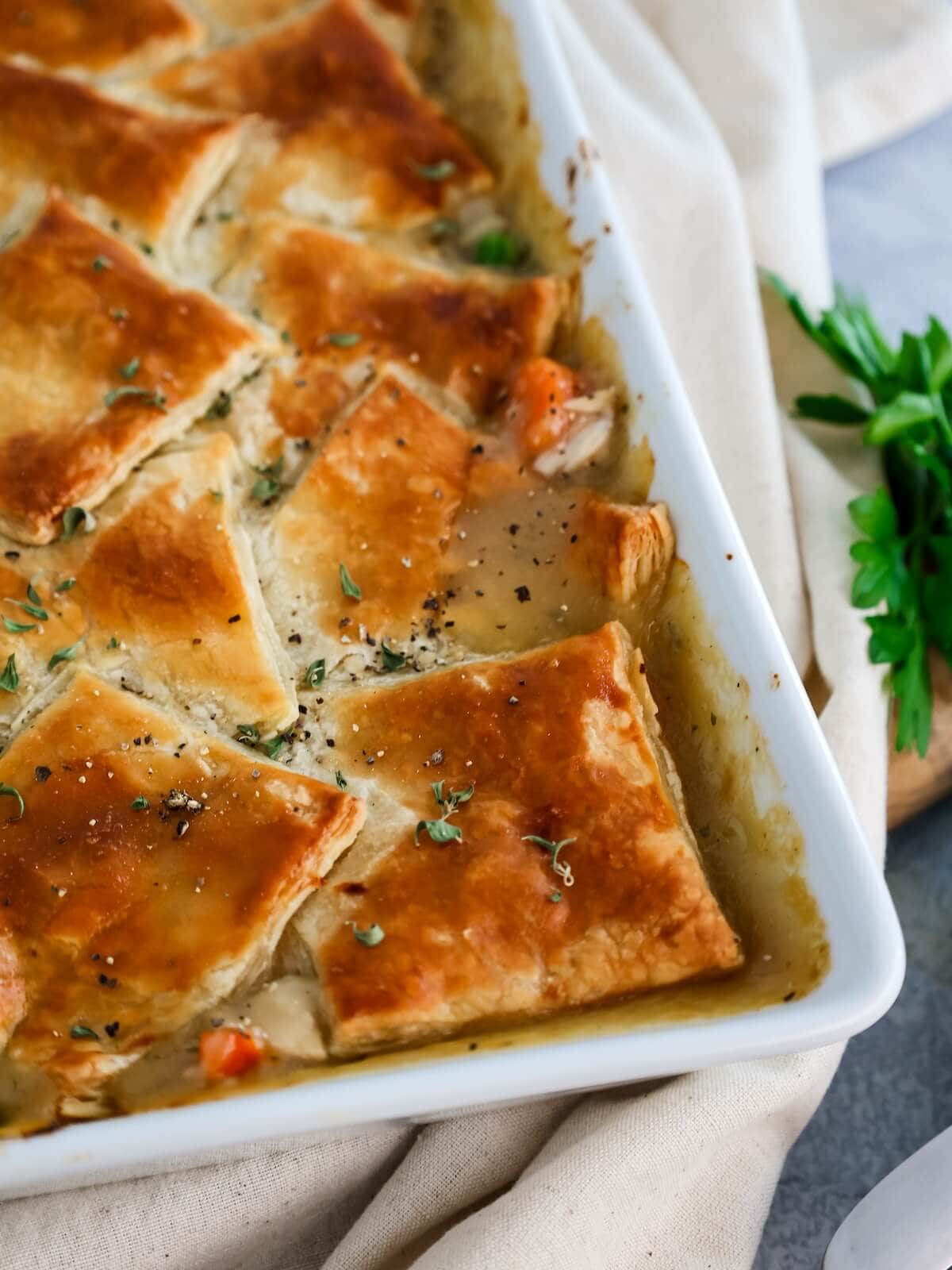 close up of the top of baked puff pastry on a turkey pot pie.