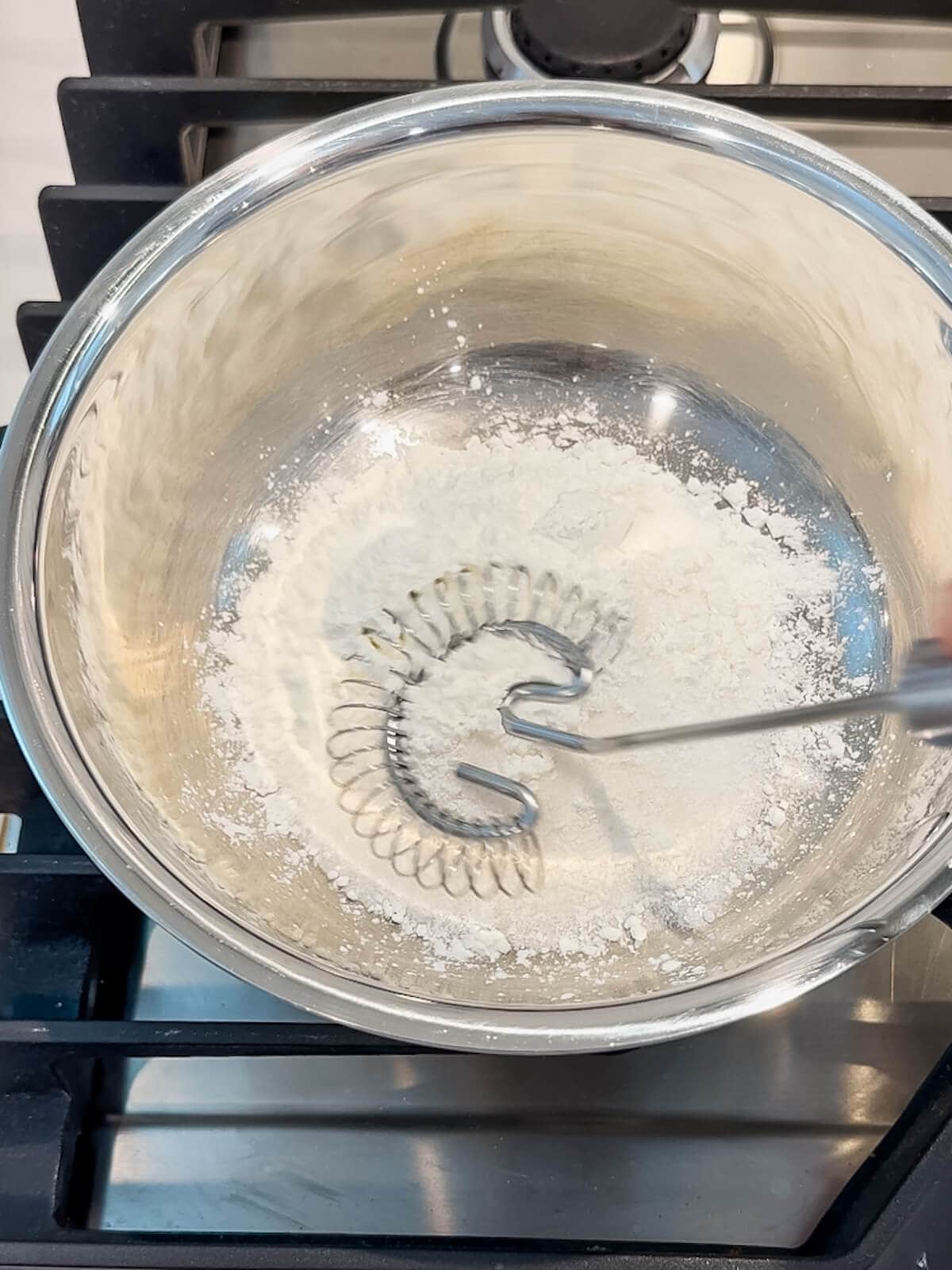 Whisk together the sugar and cornstarch for the lemon curd to break up lumps for lemon lush filling.