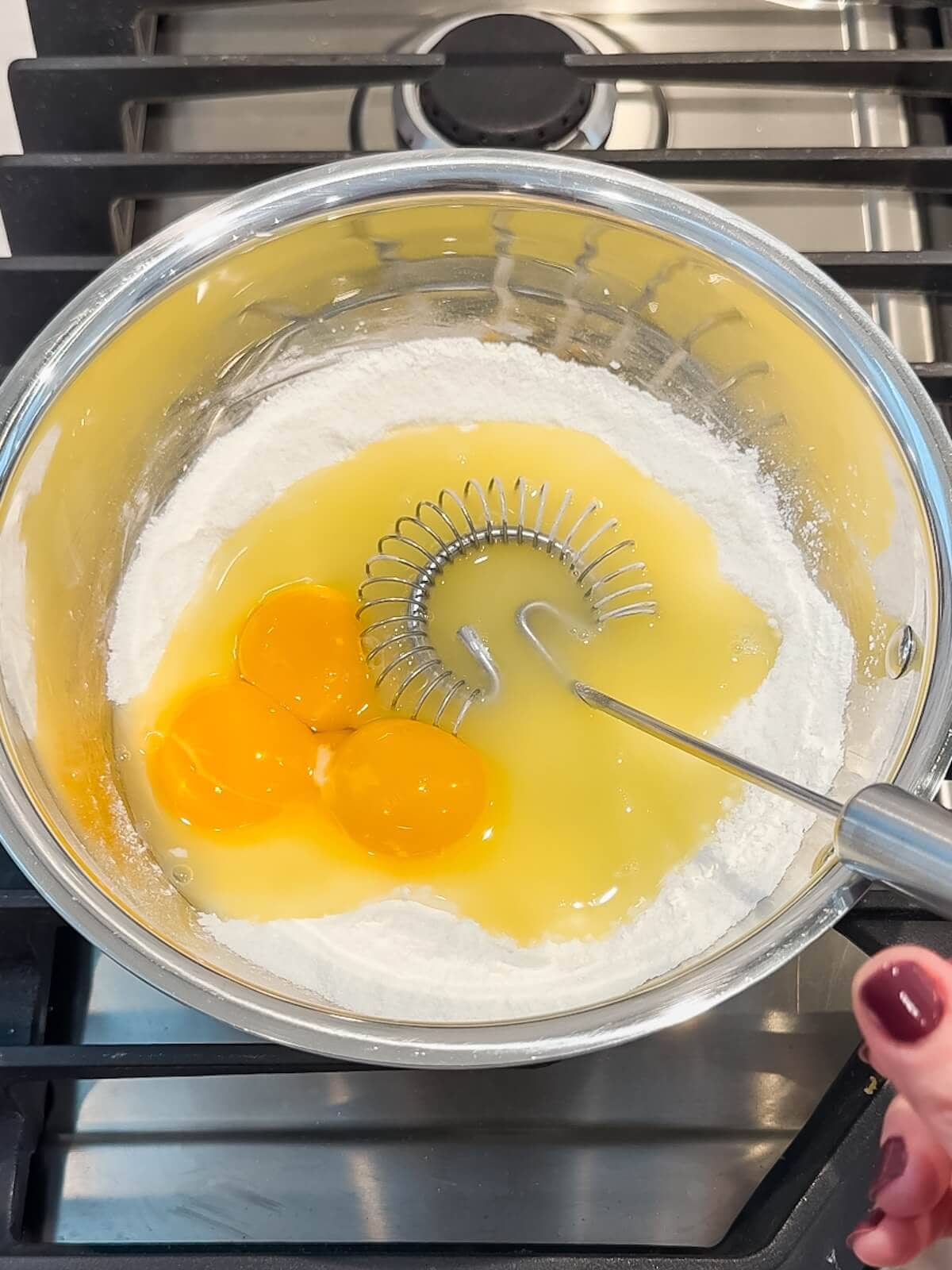 whisk eggs into dry ingredients for the lemon curd.