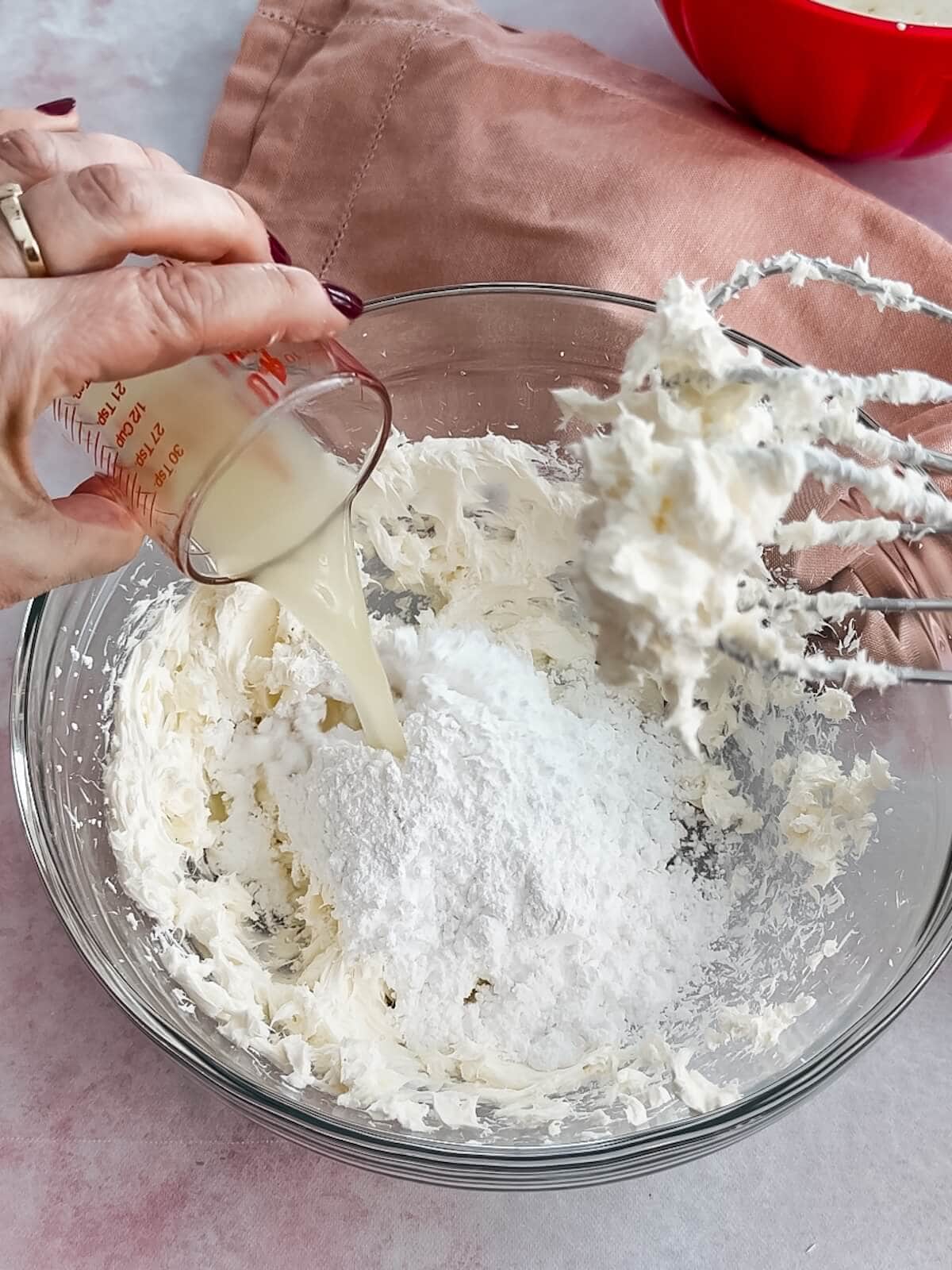 Adding sugar, lemon juice and vanilla to the cream cheese layer of lemon lush.