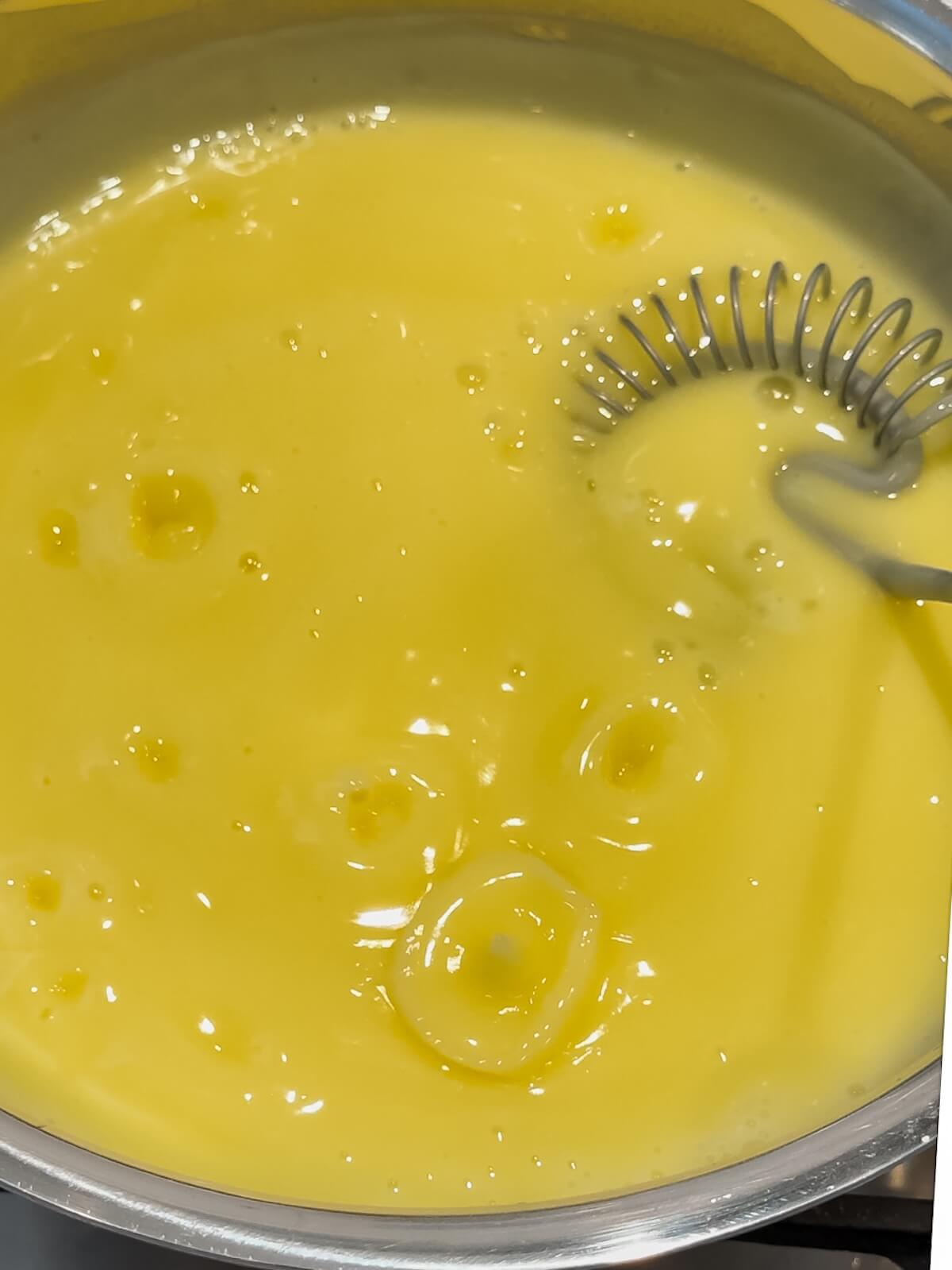 cook lemon curd until it is bubbling, whisking constantly.
