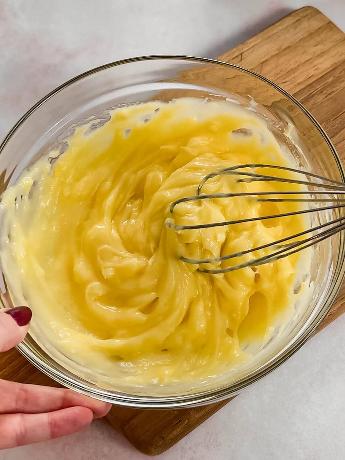 Whisk and stir chilled curd to make smooth before adding to lemon lush.