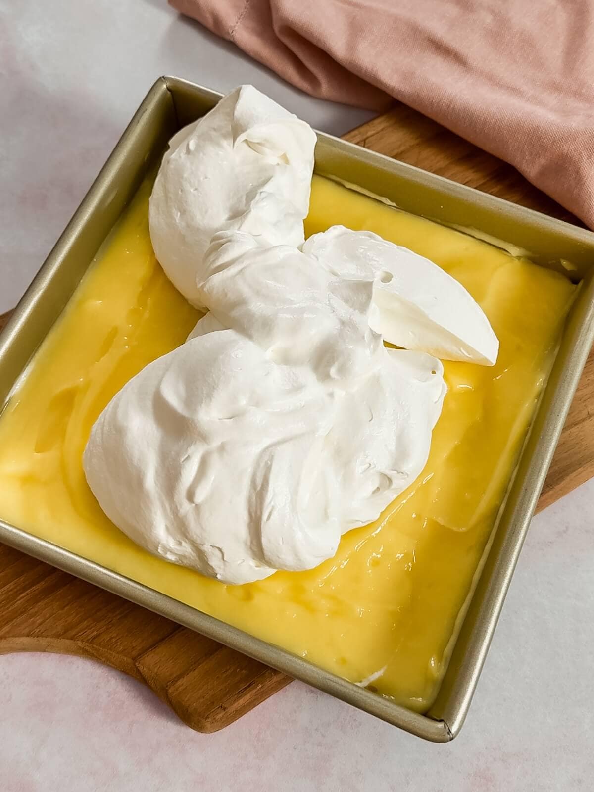 add whipped cream topping to lemon lush.