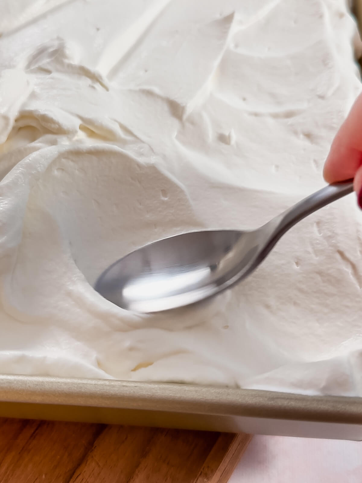spread topping with a spoon to create pretty swoops for lemon lush.