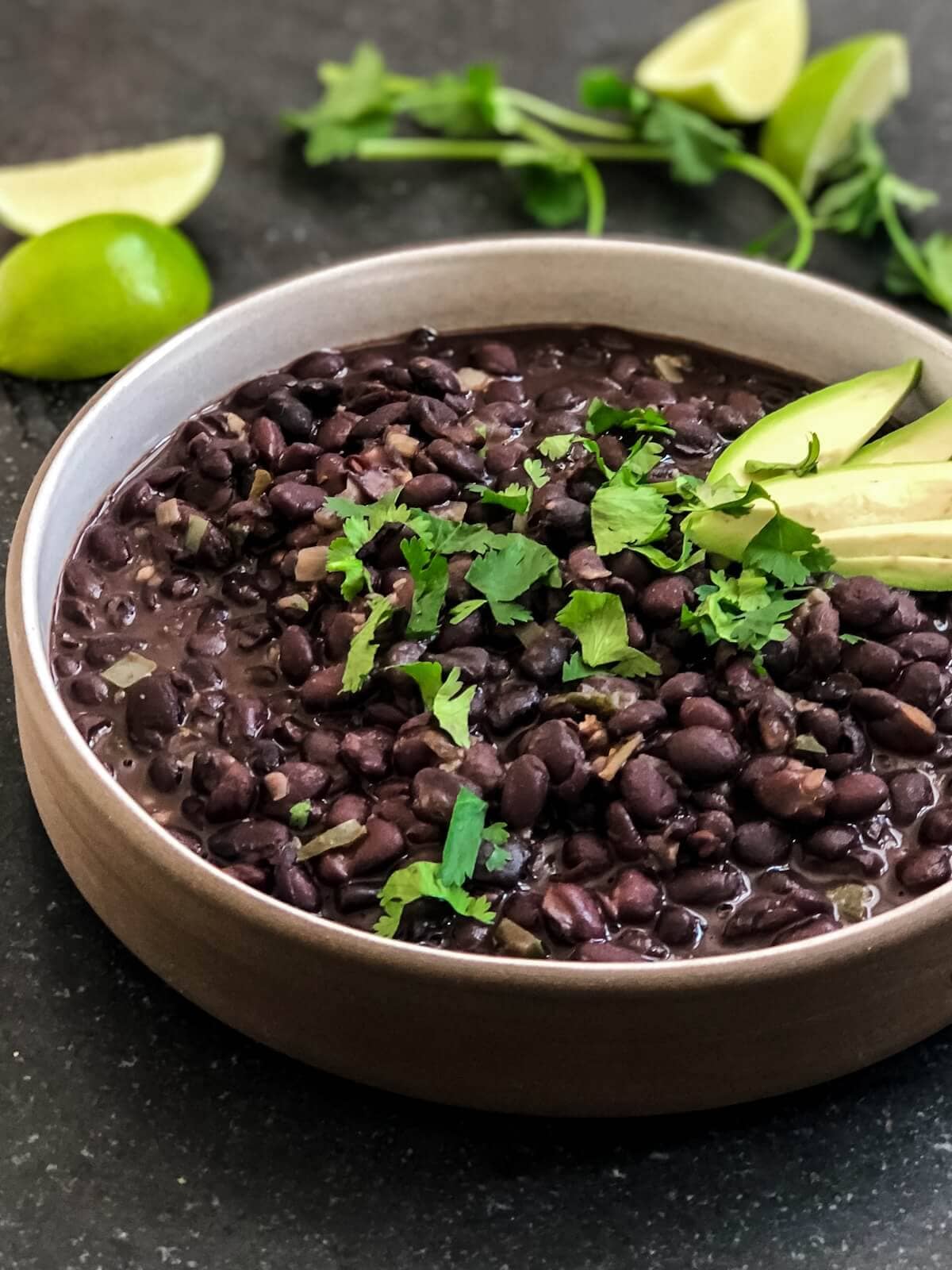 Creamy black beans in a bowl ready to eat.